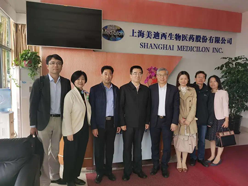 中国药科大学党委书记金能明与米乐YY易游首席执行官陈春麟博士